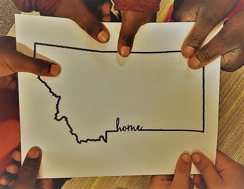 Students holding map of Montana